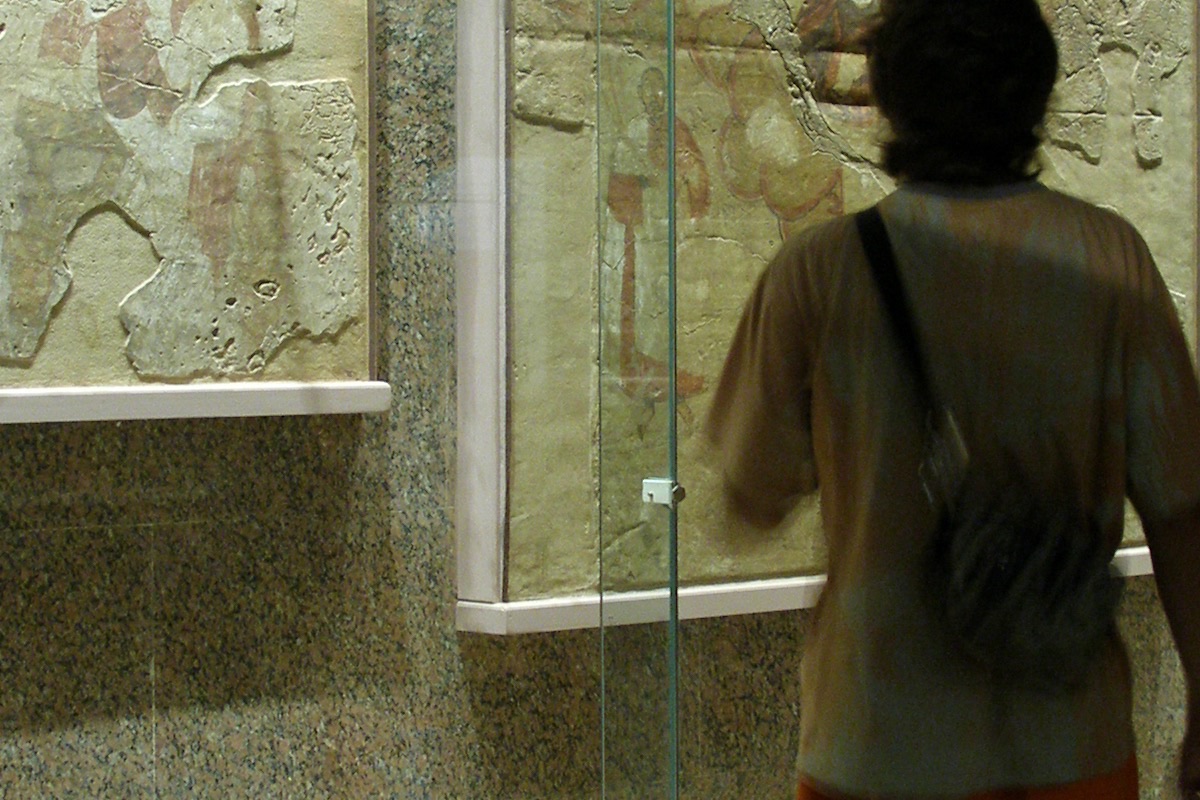 Visitor viewing Byzantine-period frescoes in the Nubia Museum in Aswan